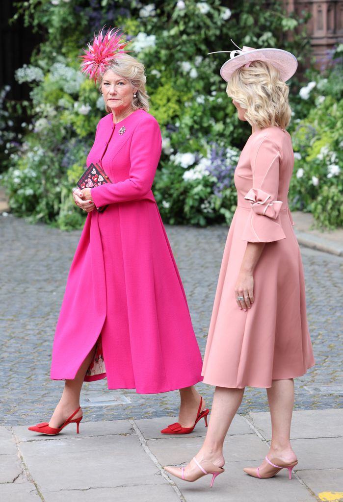 The mother of the groom, Natalia Grosvenor, Duchess of Westminster, arrived wearing a pink dress and pink fascinator
