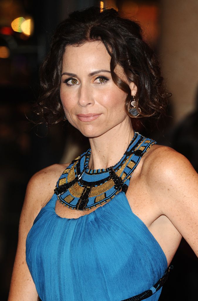 Actress Minnie Driver attends the 'Conviction' Premiere during the BFI London Film Festival in a blue dress