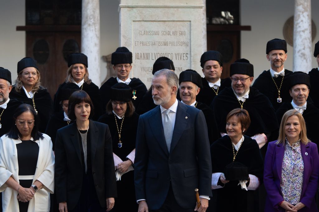 King Felipe standing with members of a crowd