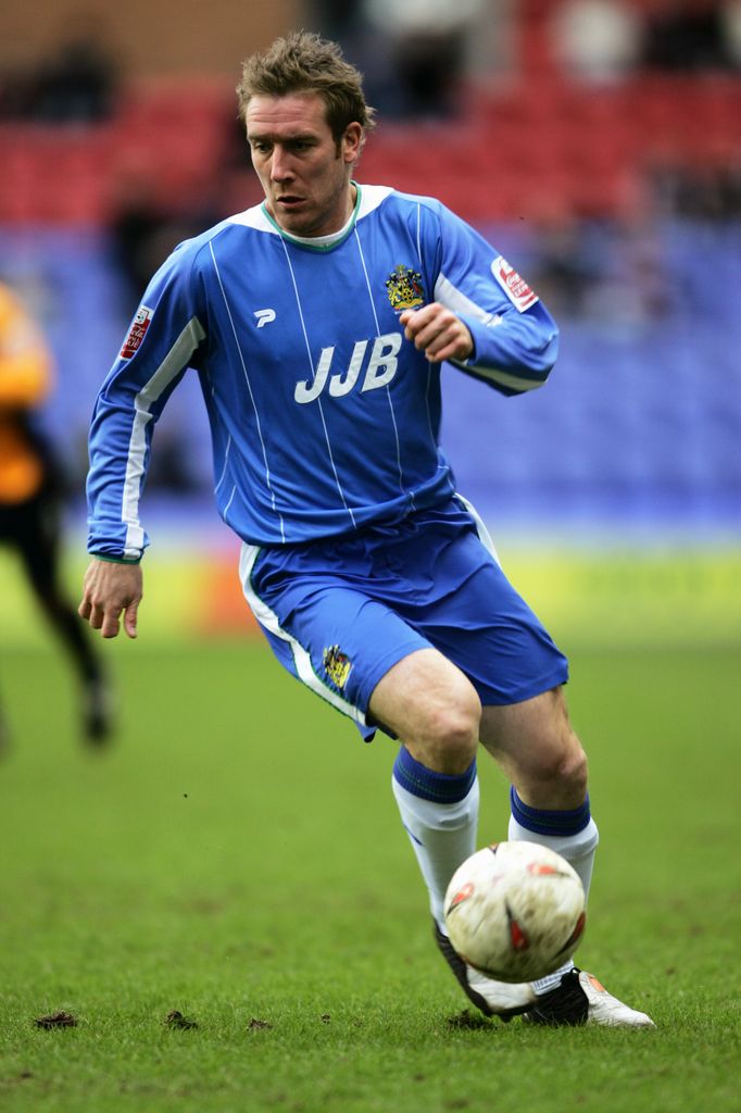 David Graham playing football in a blue kit