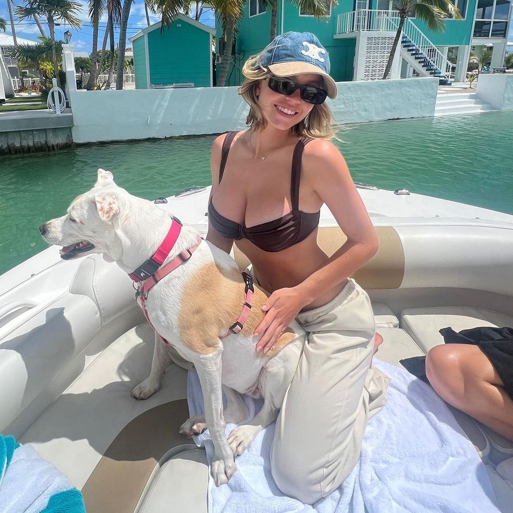 Sydney Sweeney wearing a bikini and joggers on a boat trip 