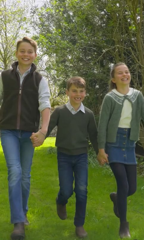 Prince George walking with Prince Louis and Princess Charlotte