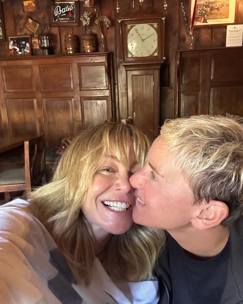 Ellen DeGeneres and Portia de Rossi laughing face to face
