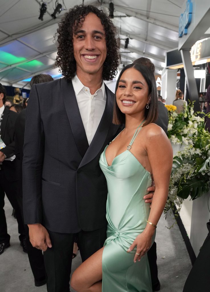 vanessa in mint green dress and cole in dark suit 