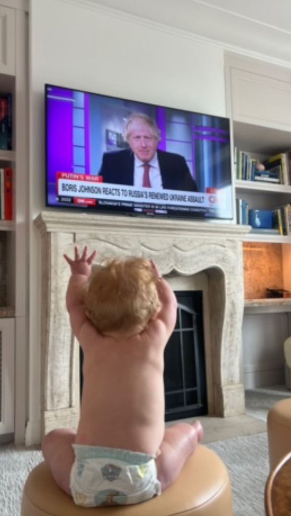 Carrie Johnson's son Frank raising his hands at his dad Boris on TV