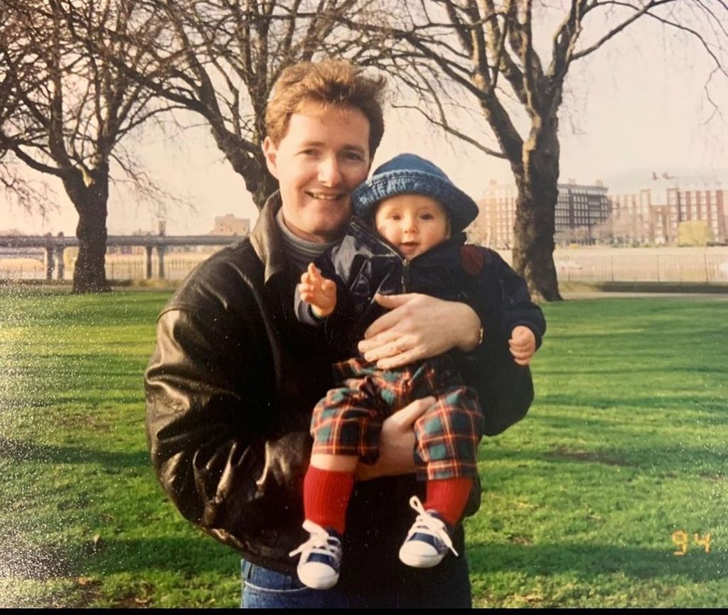 Piers Morgan holding his toddler son Spencer outside