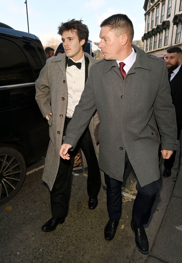 Romeo Beckham arrives for the Olympian Adam Peaty's wedding to Holly Ramsay at Bath Abbey in Bath