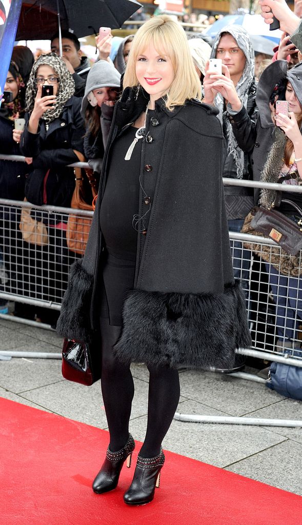 Pregnant Amanda Holden in a bump-skimming black dress and heels