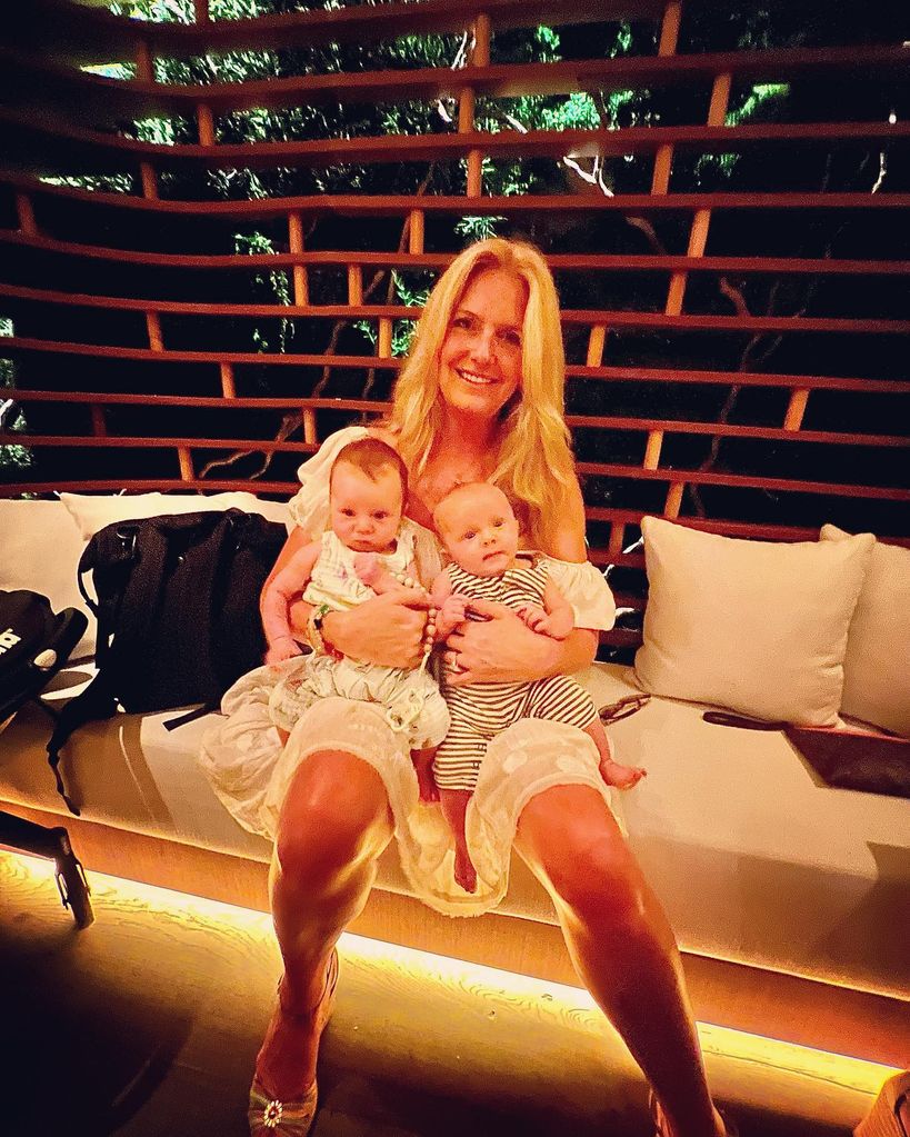 penny lancaster holding grandsons louie and otis 