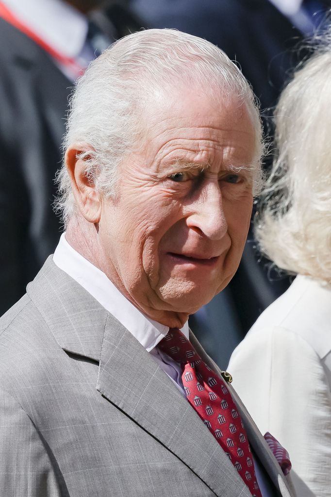 King Charles in a grey suit