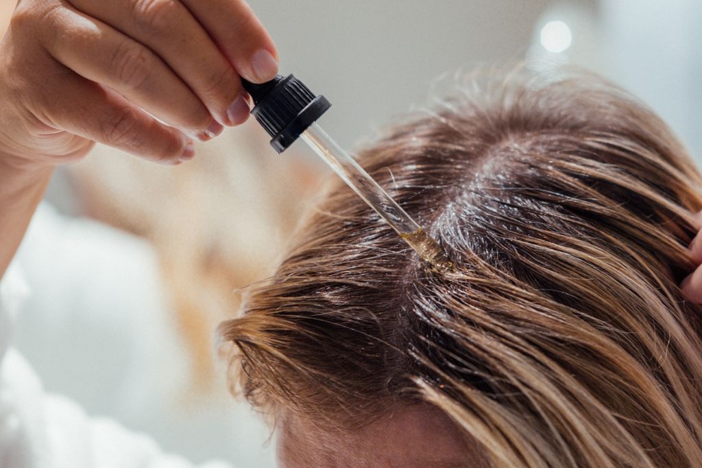 Scalp slugging - where you apply oil to your scalp - is the newest Tik Tok craze