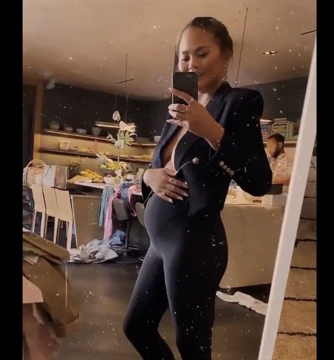 Chrissy Teigen shows off her baby bump 