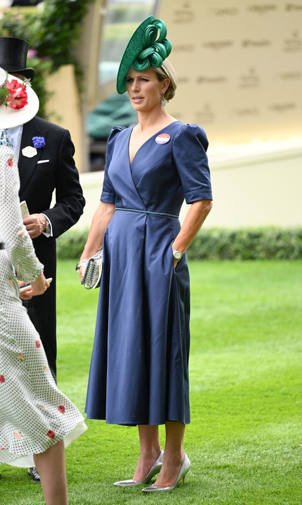 Zara Tindall wore a blue Laura Green dress on day two, which she accessorised with a gorgeous green hat by Juliette Millinery