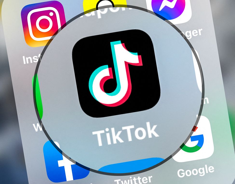 This photograph taken on March 23, 2022, shows logo of the networking application TikToK displayed on a tablet in Lille, northern France