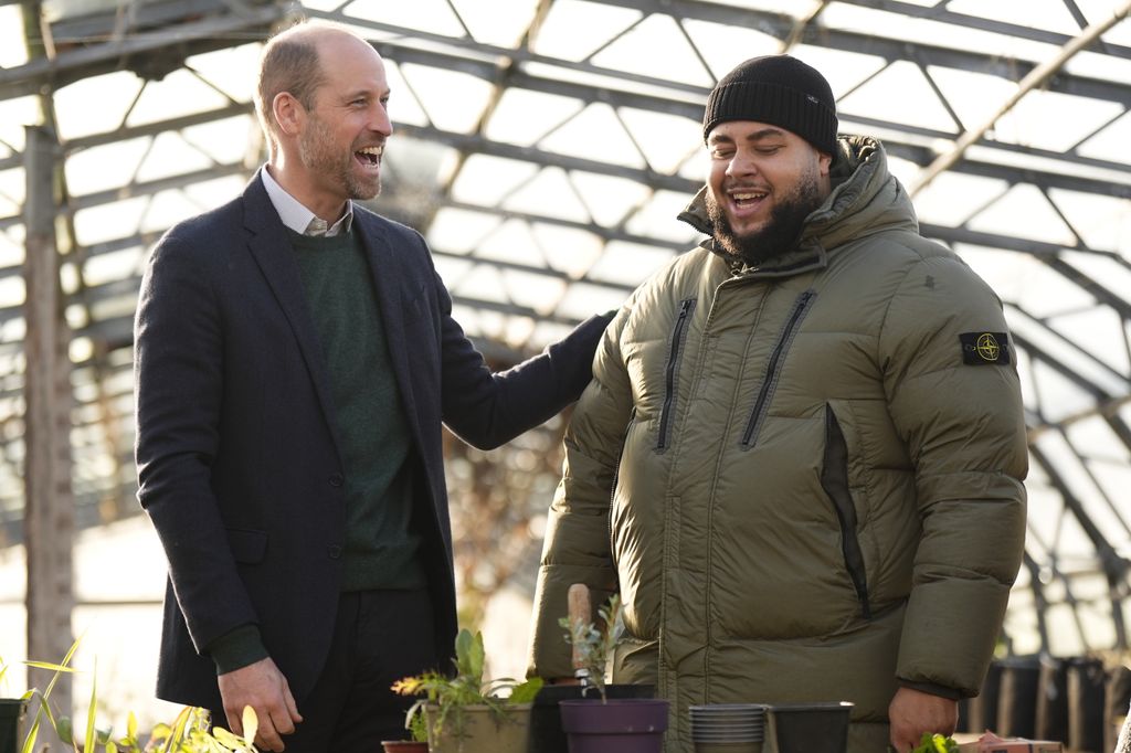 Prince William, Prince of Wales speaks with Big Zuu (R) in one of the greenhouses during a visit to BBC Children In Need's We Move FWD programme on January 28, 2026