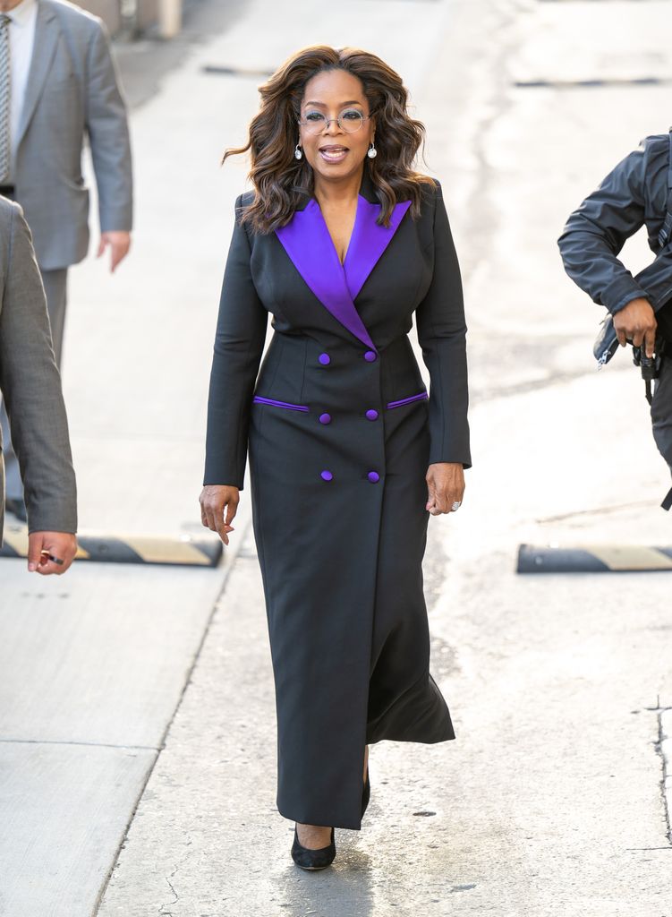 Oprah black dress with pop of purple