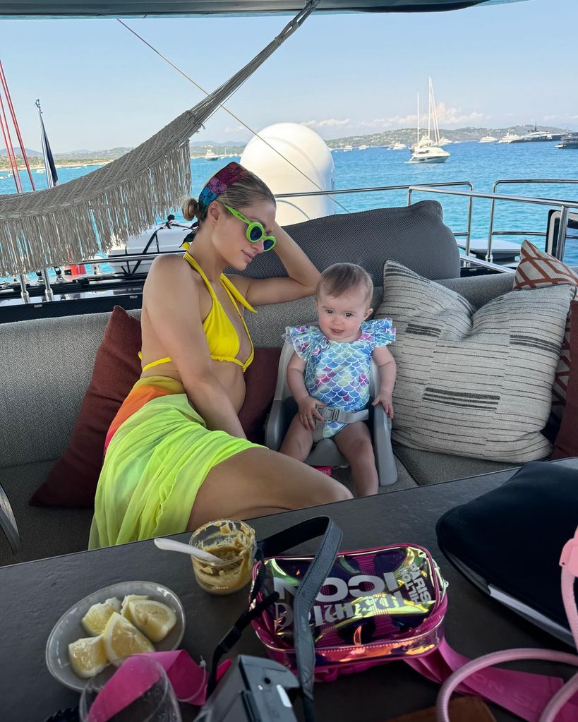 paris hilton yellow bikini on board a yacht with daughter london