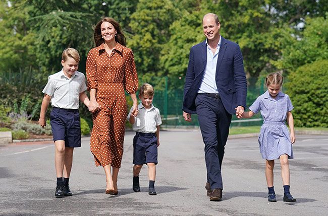 Prince William and Kate Middleton walking with their three children on their first day of school in Windsor
