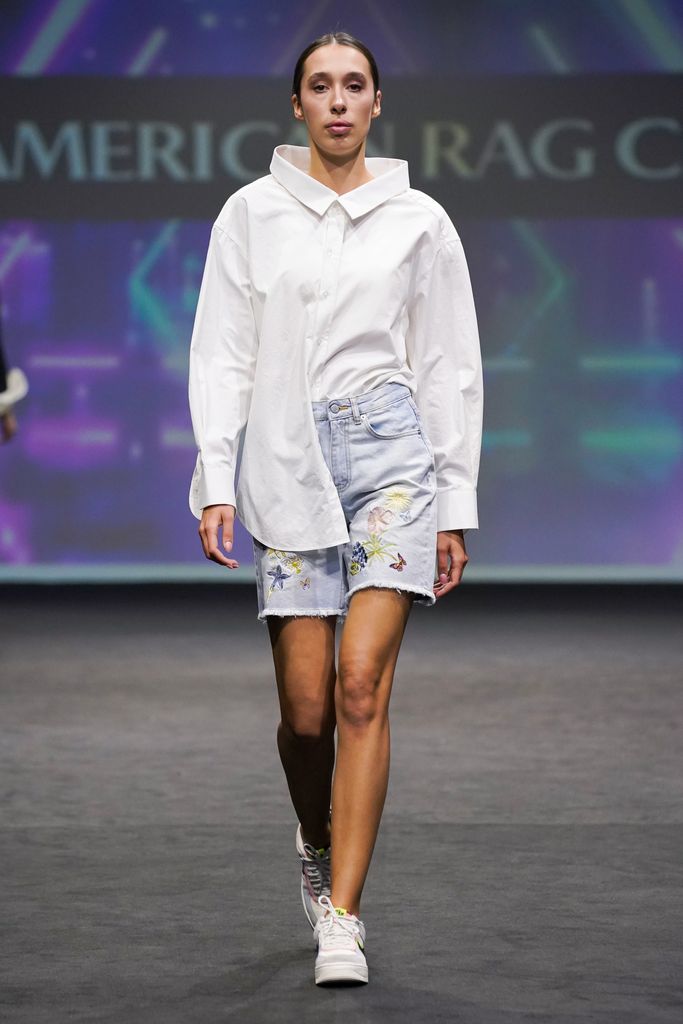 A model wears embroidered denim shorts at American Rag
