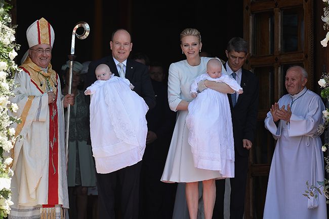 Prince Albert and Princess Charlene carrying baby children with Bernard Barsi on the left hand side