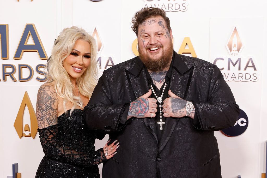 photo of jelly roll and wife bunnie xo both wearing black at cma awards 