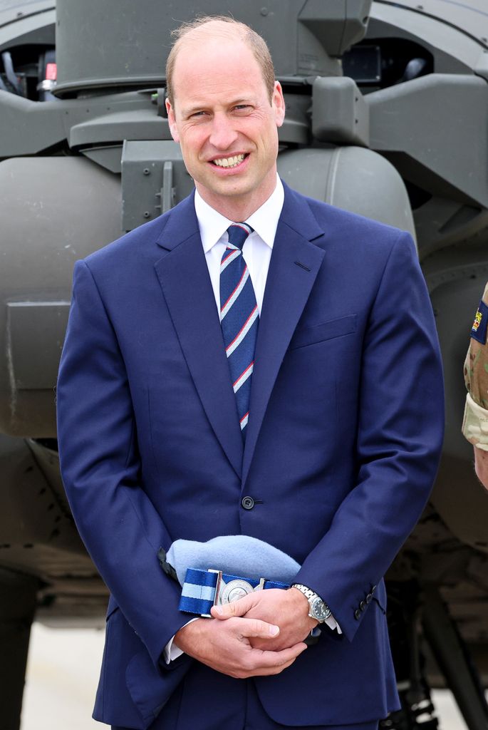 Prince William smiles at military handover