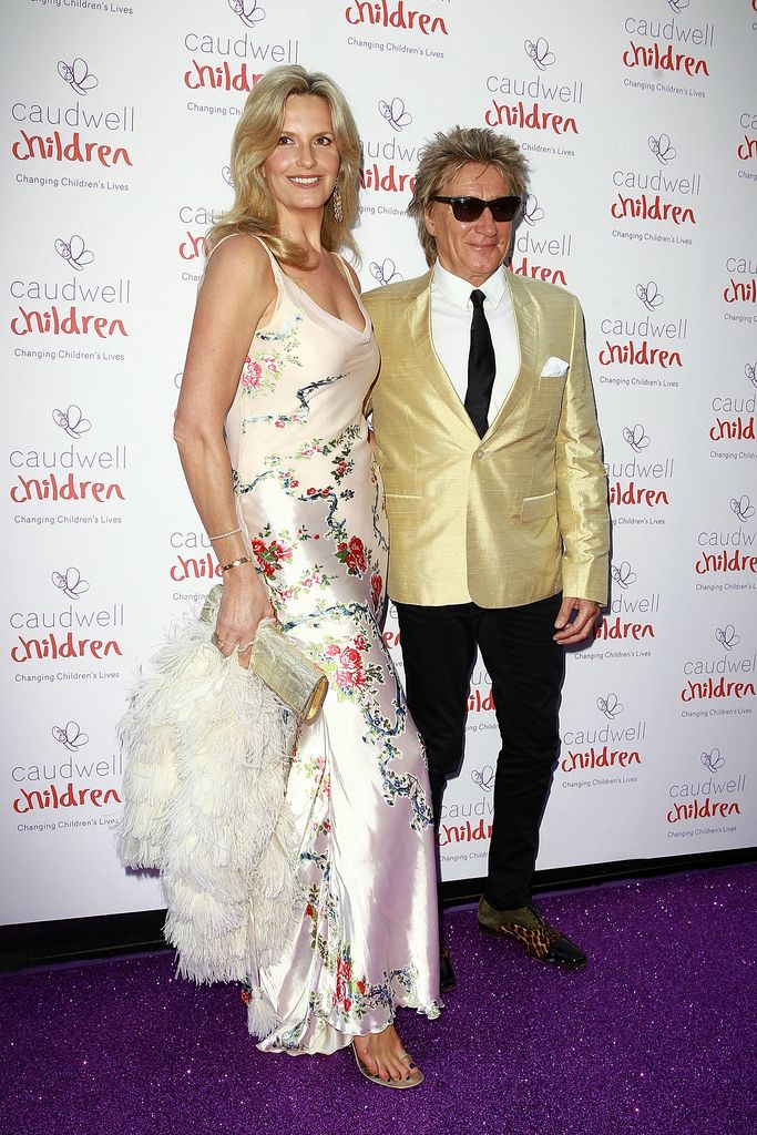 Penny Lancaster in floral slip dress and Rod Stewart on red carpet