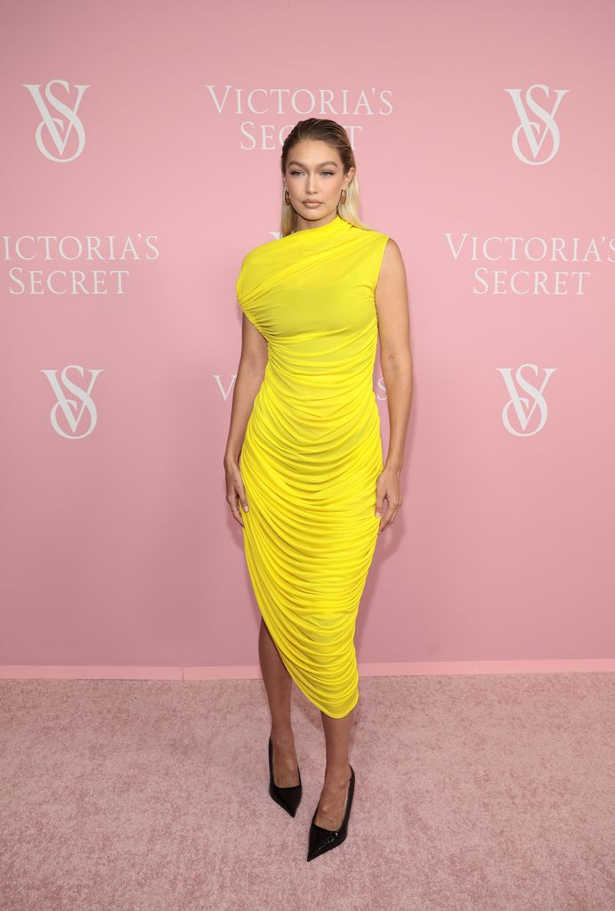 Gigi Hadid in asymmetric yellow dress at Victoria's Secret Celebrates The Tour 23