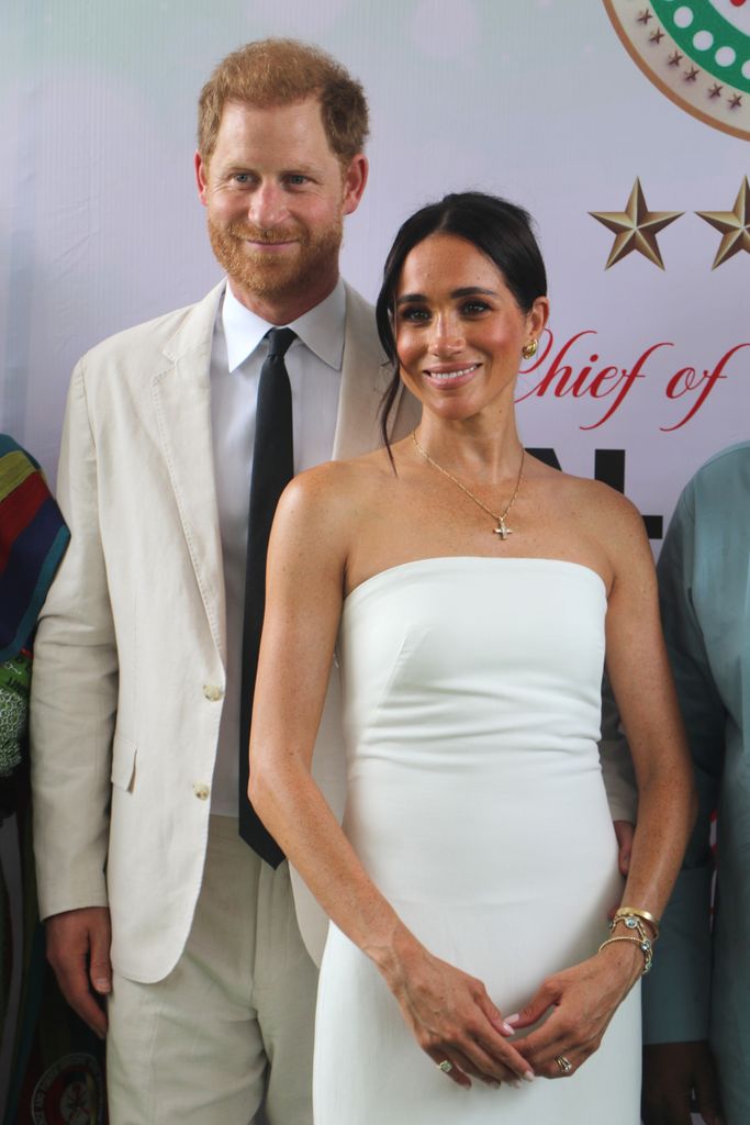 Britain's Prince Harry, Duke of Sussex, and Britain's Meghan, Duchess of Sussex, pose for a photo as they attend the program held in the Armed Forces Complex in Abuja, Nigeria on May 11, 2024. (Photo by Emmanuel Osodi/Anadolu via Getty Images)