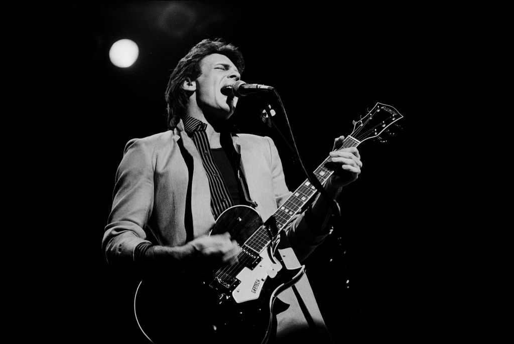 Rick Springfield plays guitar as he performs onstage at the Holiday Star Theater, Merilville in 1981.