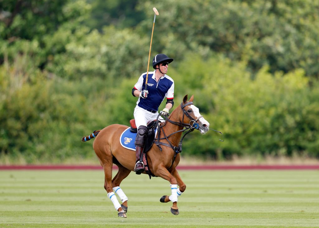 Prince William playing polo on a horse