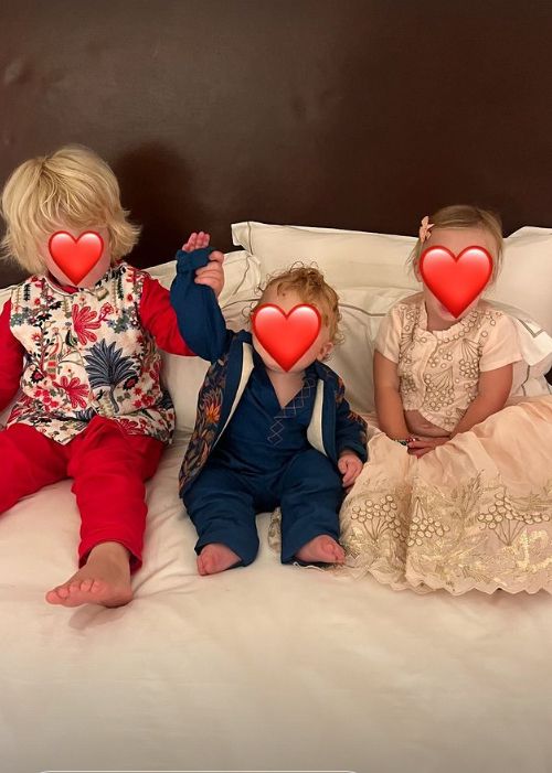 Three children in traditional wedding outfits