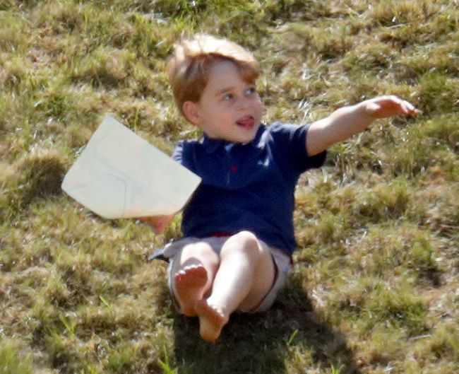 prince george playing in grass