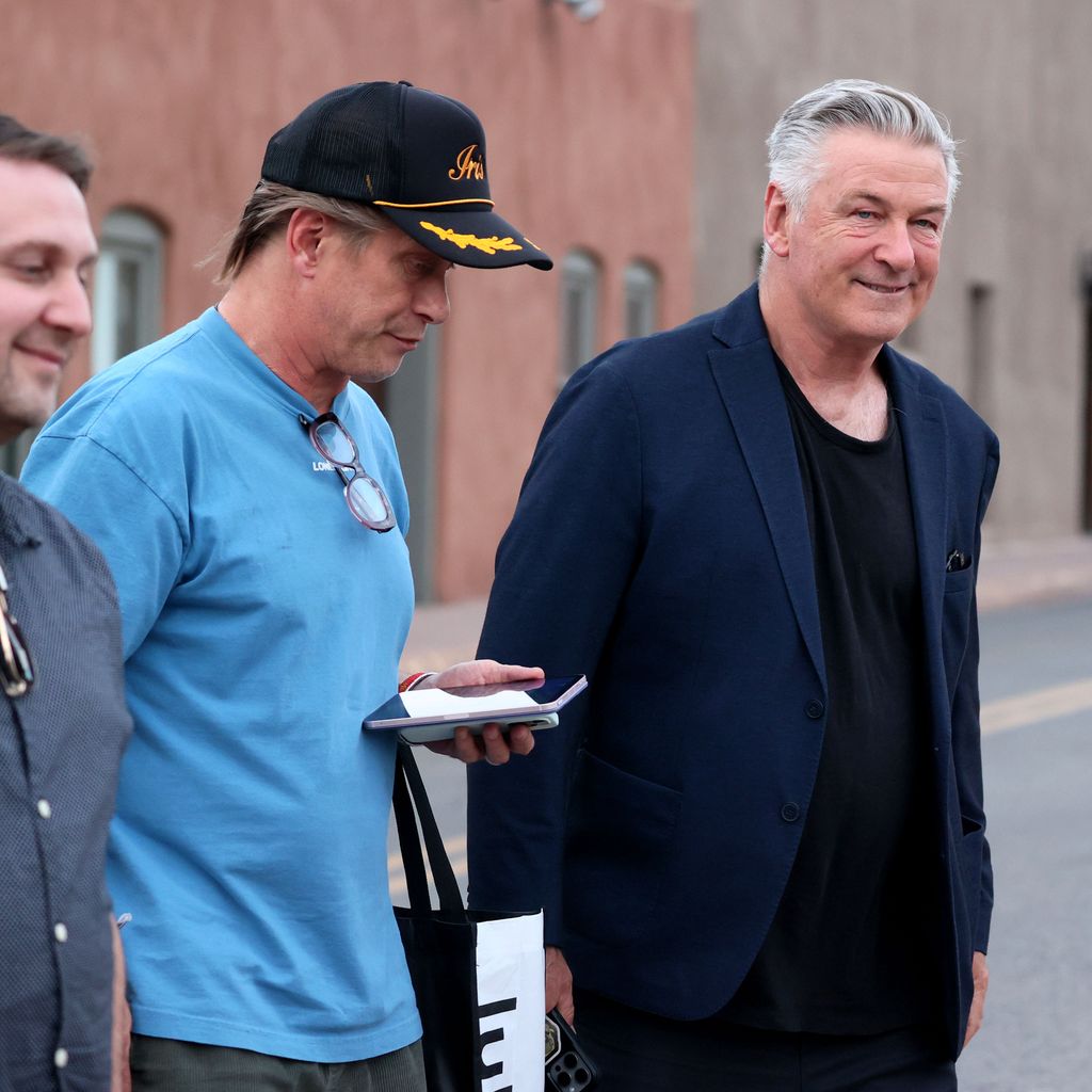 Alec Baldwin smiles with relief as he heads to a celebratory dinner with his siblings and friends after his involuntary manslaughter trial was dismissed 