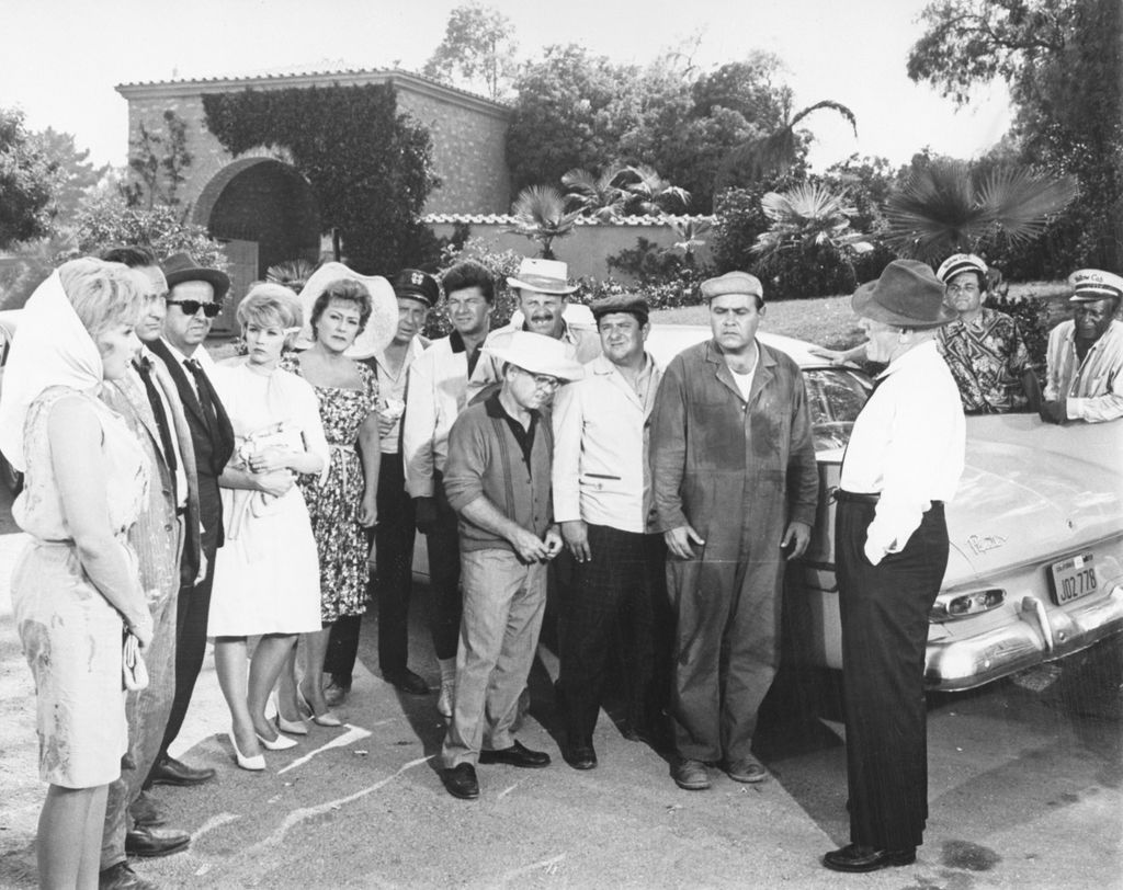 Members of the cast of the United Artists movie "It's a Mad, Mad, Mad, Mad World." L to r: Edie Adams, Sid Caesar, Phil Silvers, Dorothy Provine, Ethel Merman, Milton Berle, Dick Shawn, Terry-Thomas, Mickey Rooney (front); Buddy Hackett, Jonathan Winters, Spencer Tracy, Peter Falk and Eddie "Rochester" Anderson. They were rehearsing a scene for the zany film.