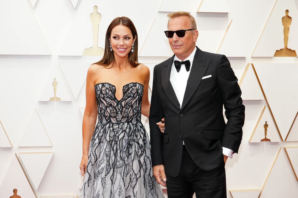 Christine Baumgartner and Kevin Costner attend the 94th Annual Academy Awards at Hollywood and Highland on March 27, 2022 in Hollywood, California. (Photo by Jeff Kravitz/FilmMagic)