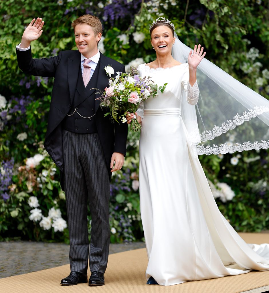 Duke and Duchess of Westminster waving in their wedding outfits