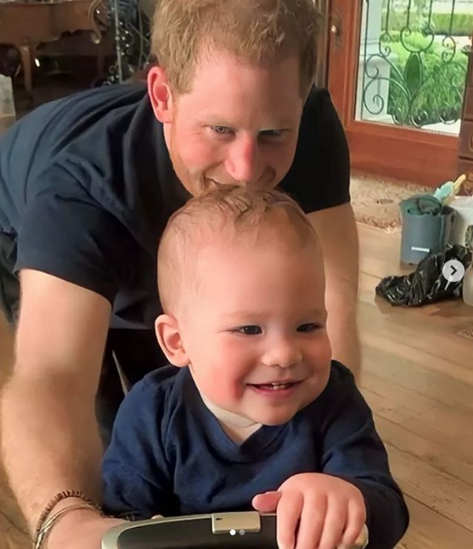 Prince Harry crawls on all fours with his son Archie in a sweet home video