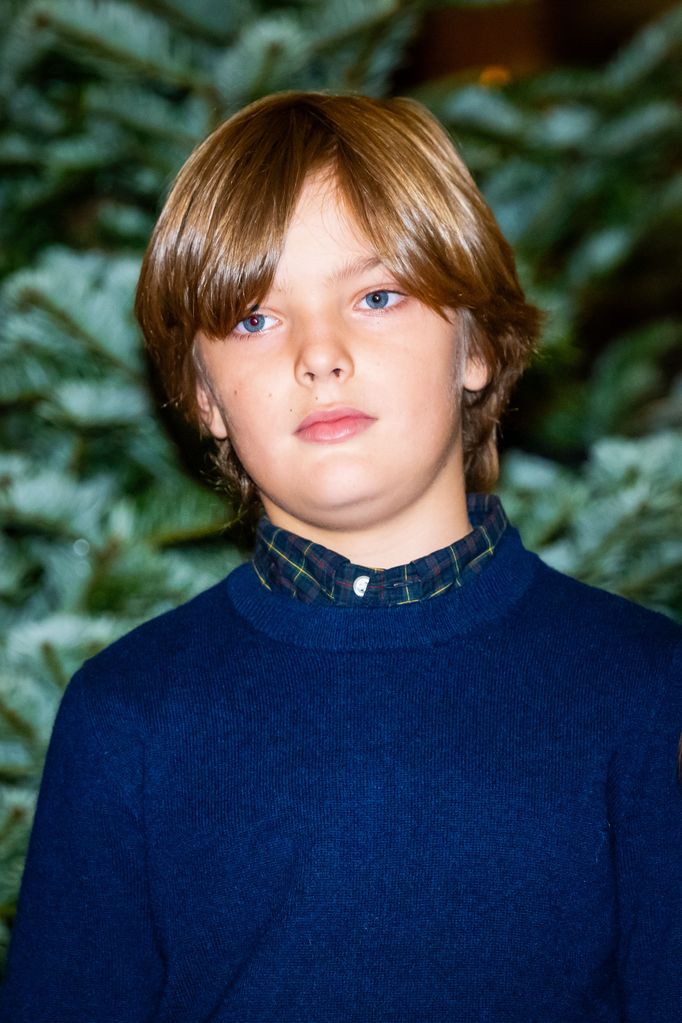 Prince Nicolas in a blue jumper and plaid shirt