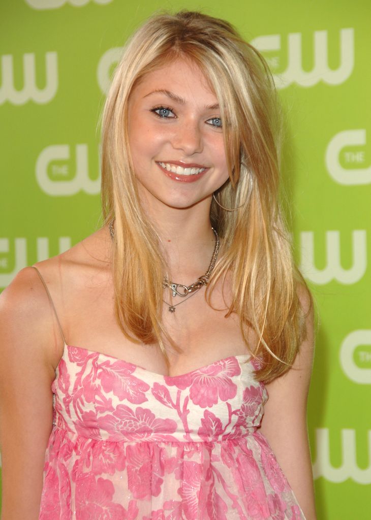 Taylor Momsen smiling in a pink floral top