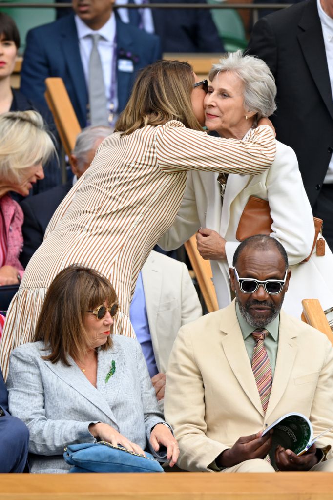 Carole Middleton kissing Duchess of Gloucester in royal box