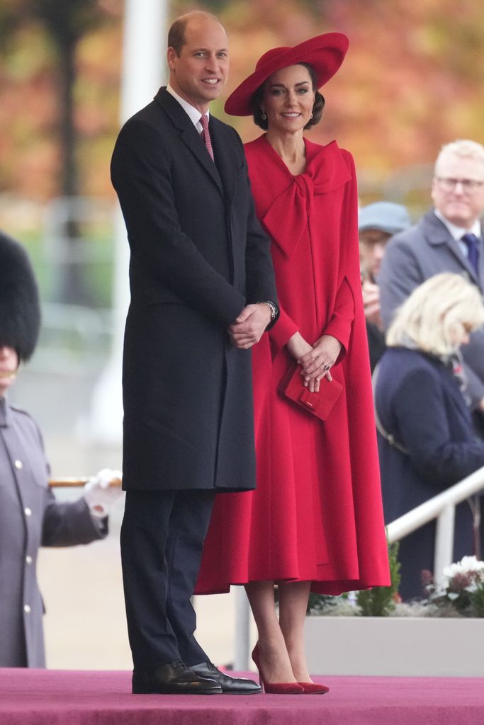 Princess Kate and william smiling on podium