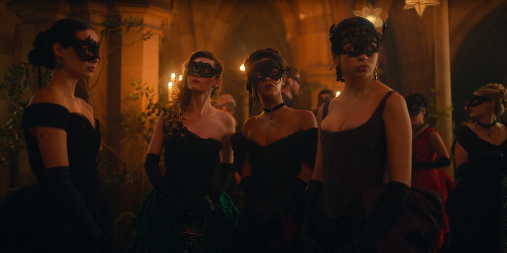 Four women at a masquerade ball