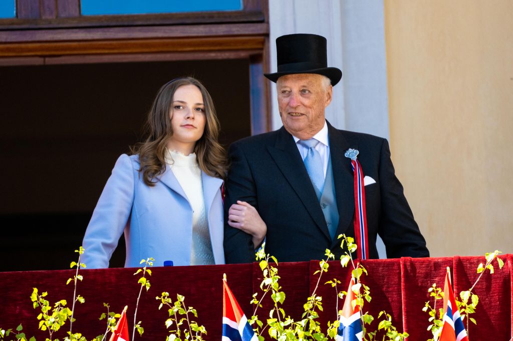 King Harald with Princess Ingrid Alexandra on palace balcony