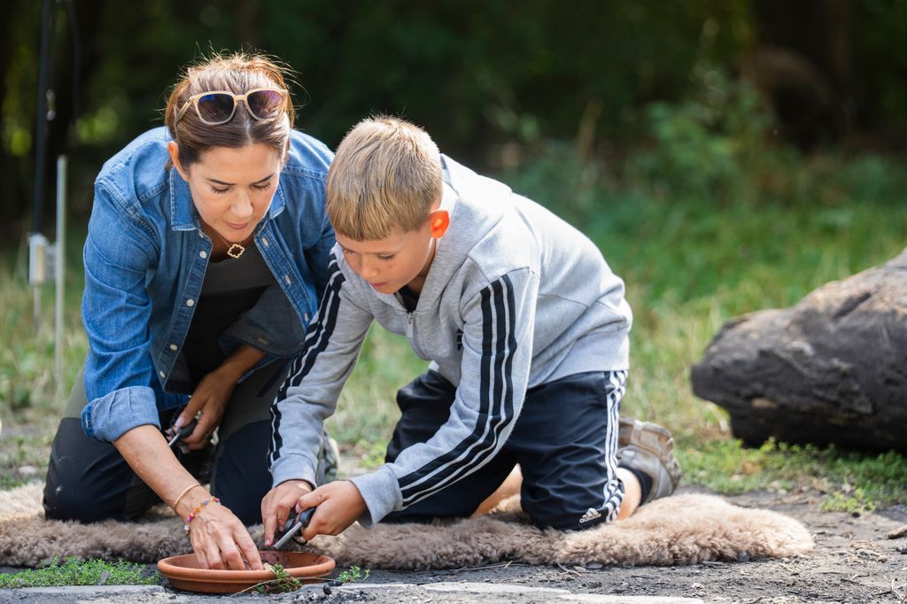 Mary worked with the children to light a bonfire