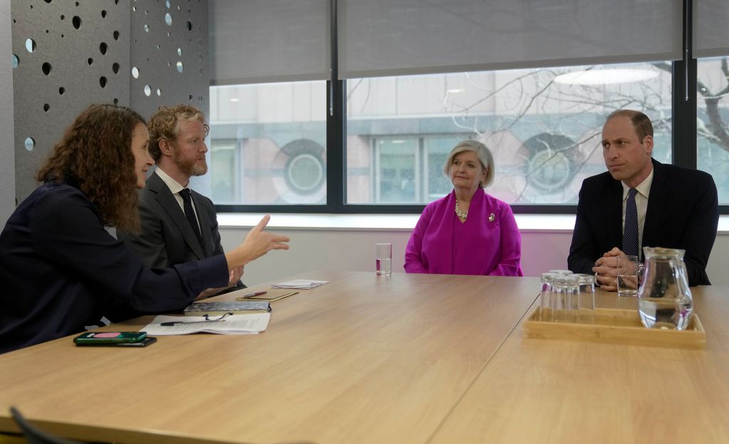 Prince William and chair Liz Padmore listen to Rory Moylan, Head of Region MENA and Europe, and Clare Clement, Director of International Law and Policy, as he visits the British Red Cross HQ 