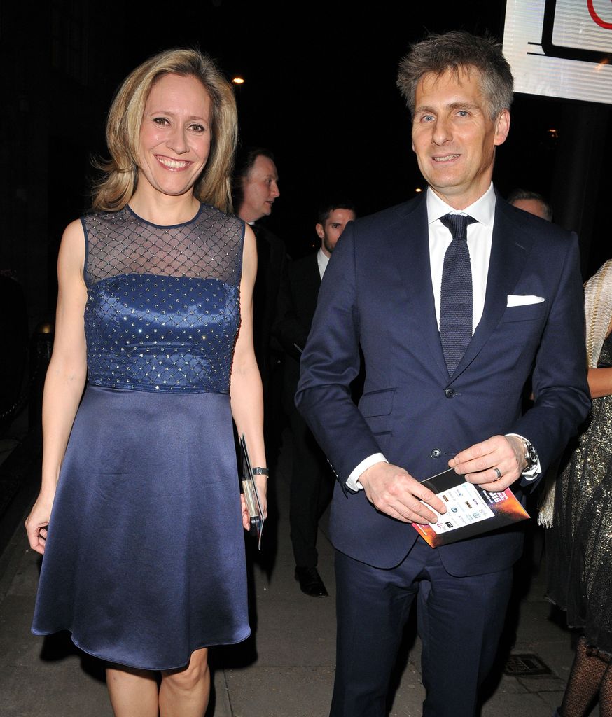 Sophie Raworth in a blue dress with husband Richard Winter