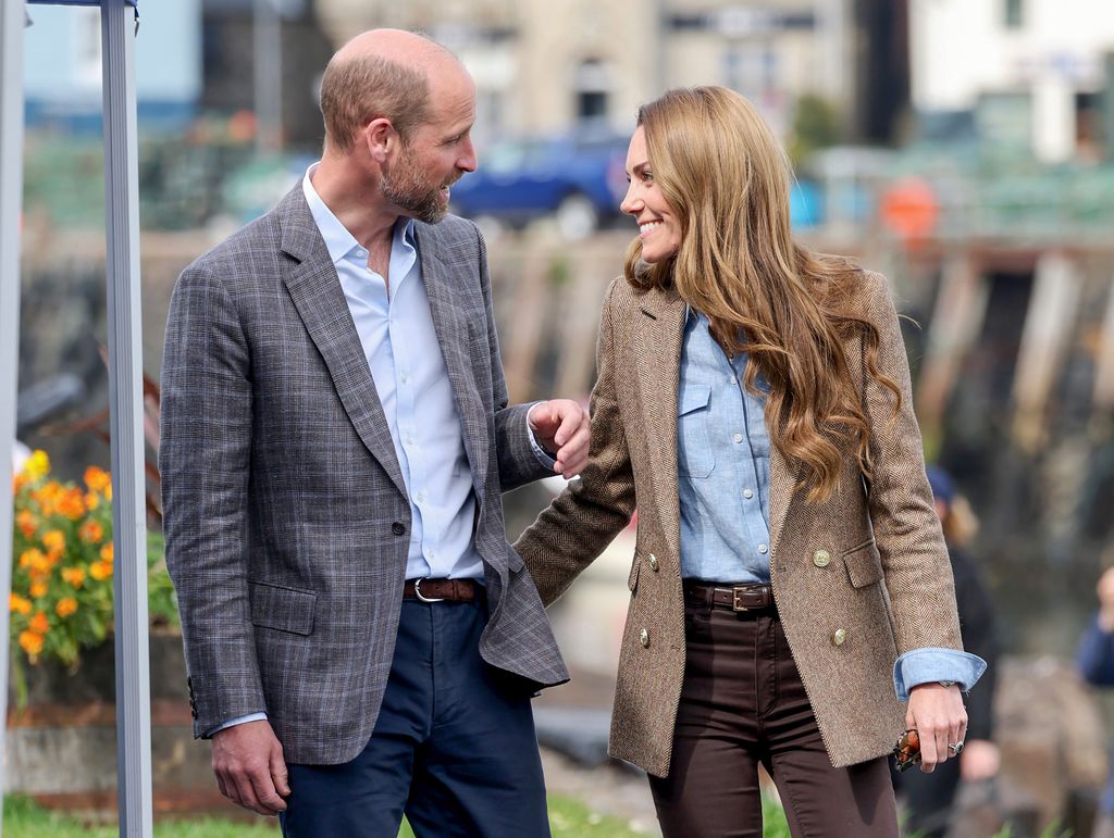 Kate Middleton smiling in William in Aros Hall