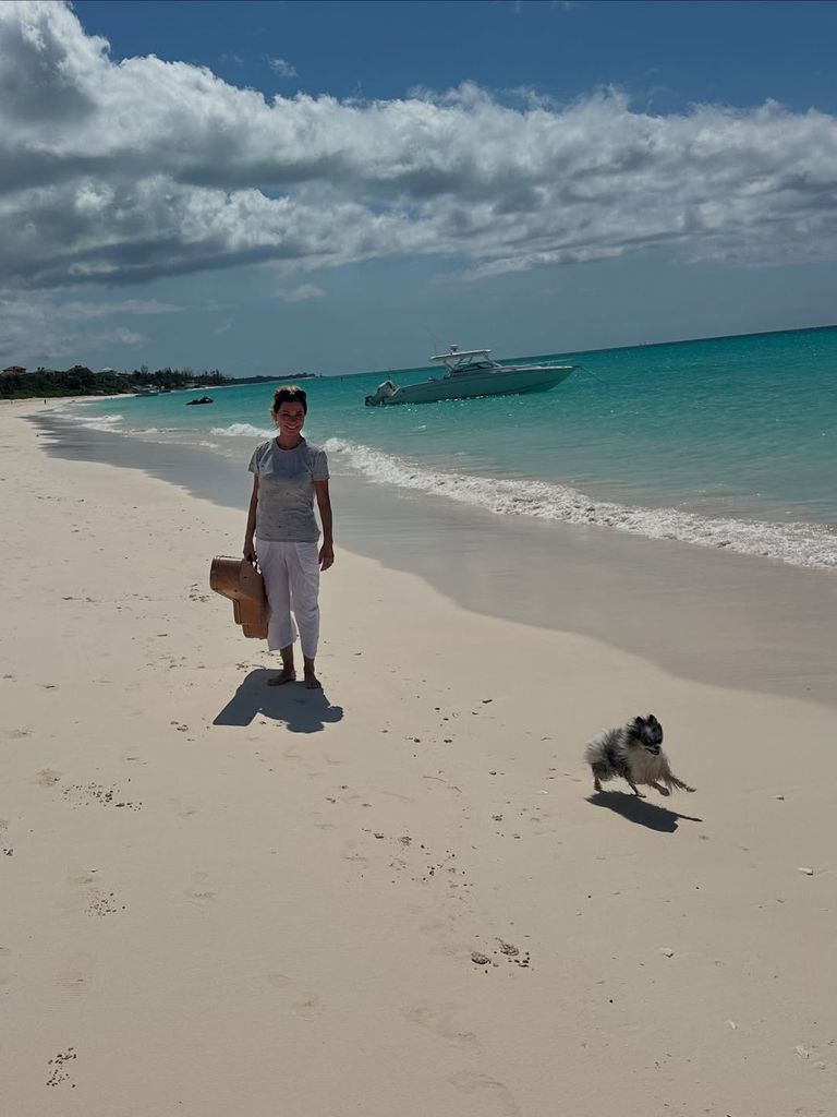 Shania on the beach with her dog