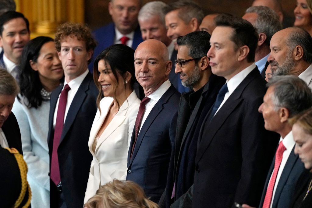 CEO of Meta Mark Zuckerberg, Lauren Sanchez, US businessman Jeff Bezos, CEO of Alphabet Inc and Google Sundar Pichai and Teska and SpaceX CEO Elon Musk are seated next to each other in the US Capitol Rotunda